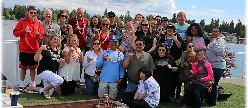 A group of people standing in front of some fire pits.