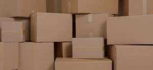 Stacked cardboard boxes in various sizes.